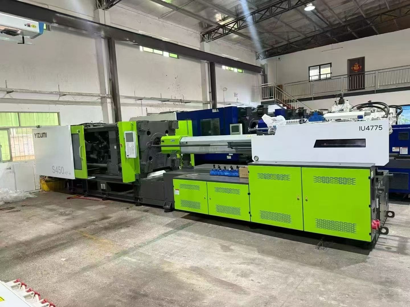Used injection molding machine prepared for service history and condition review